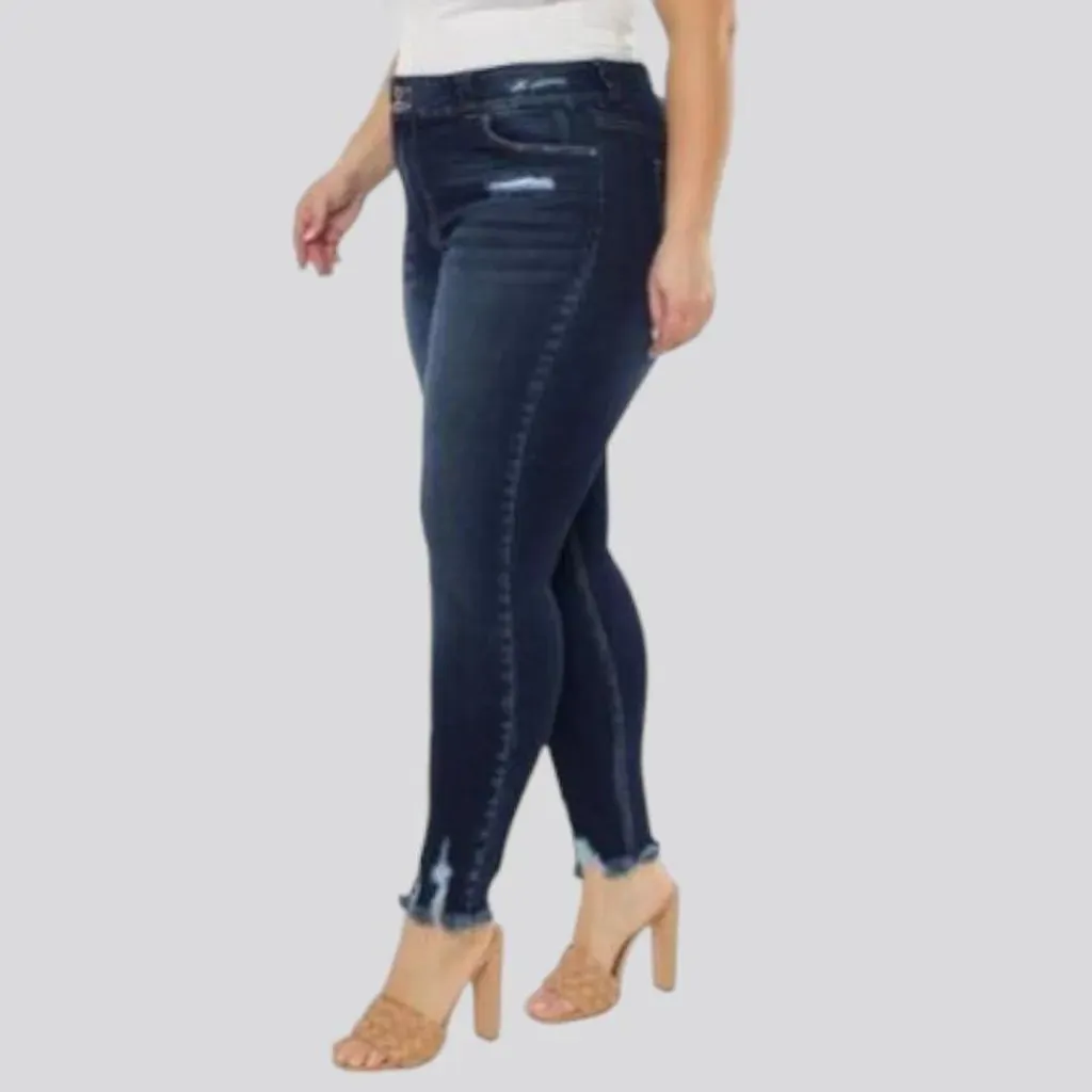 Distressed-hem sanded jeans for women